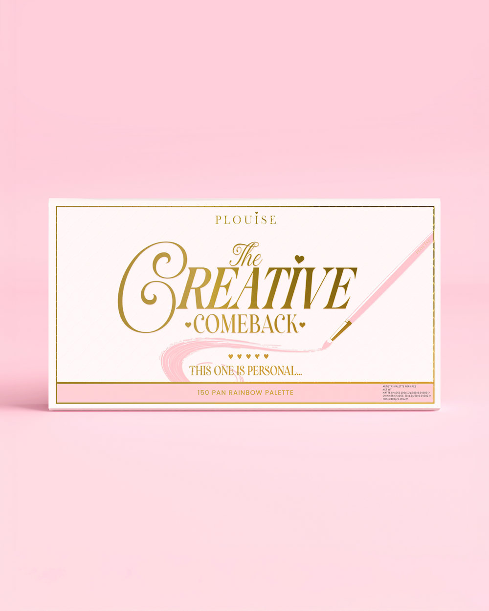 Suljetun P.Louise Creative Comeback XXXL Rainbow Eyeshadow Paletin etupuoli kultaisella typografialla vaaleanpunaisessa kotelossa vaaleanpunaista taustaa vasten