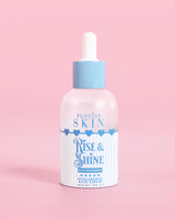 Sinivalkoinen pullo PLouise Rise and Shine Hyaluronic Serumia sinisessä vadelmassa