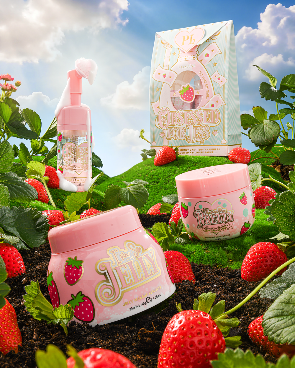 P.Louise Strawberry Obsessed For Less Double Cleanse & Moisturise Skincare Set ruohokukkulalla mansikoiden ympäröimänä